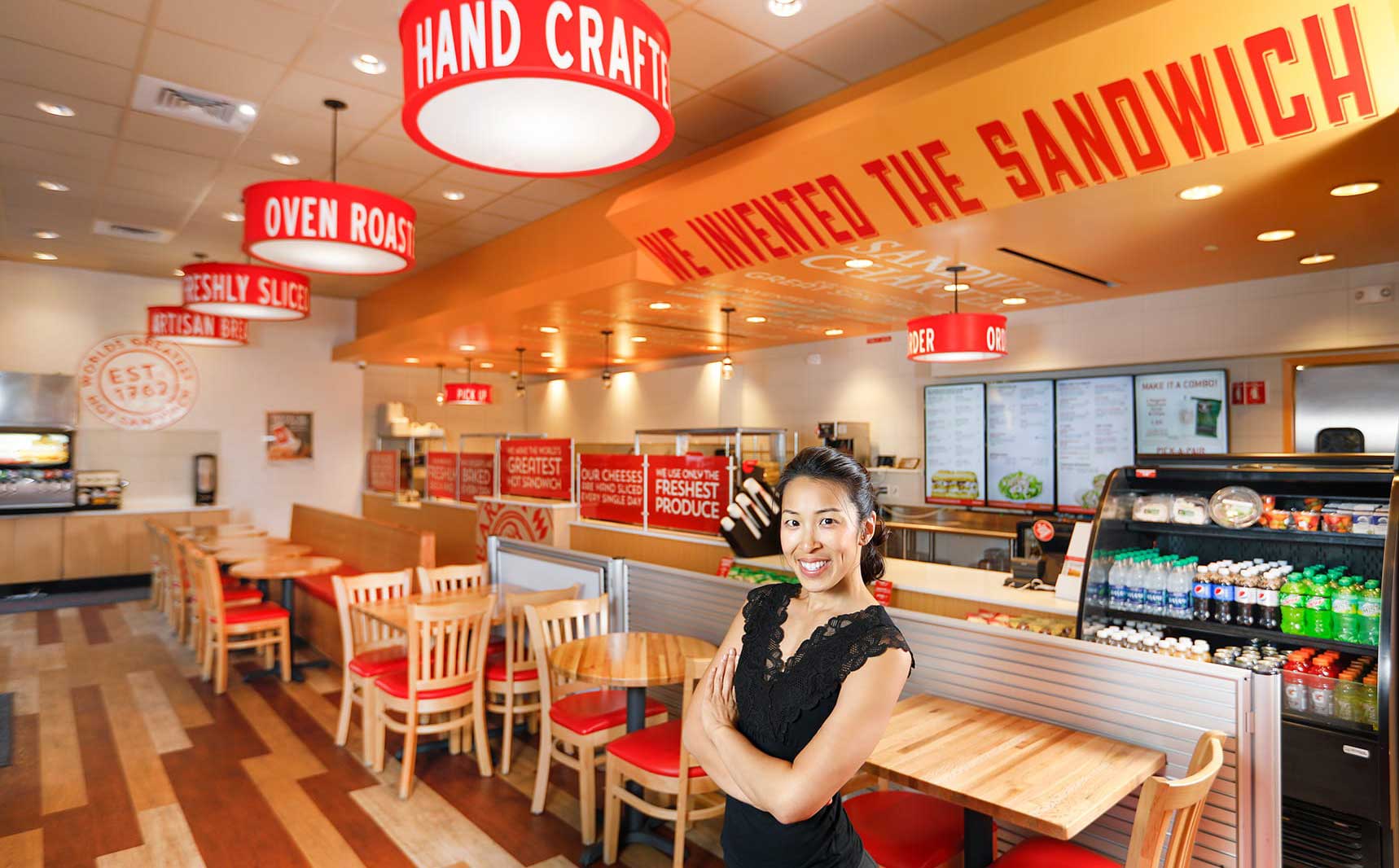 Trang Nguyen smiling inside Earl of Sandwich